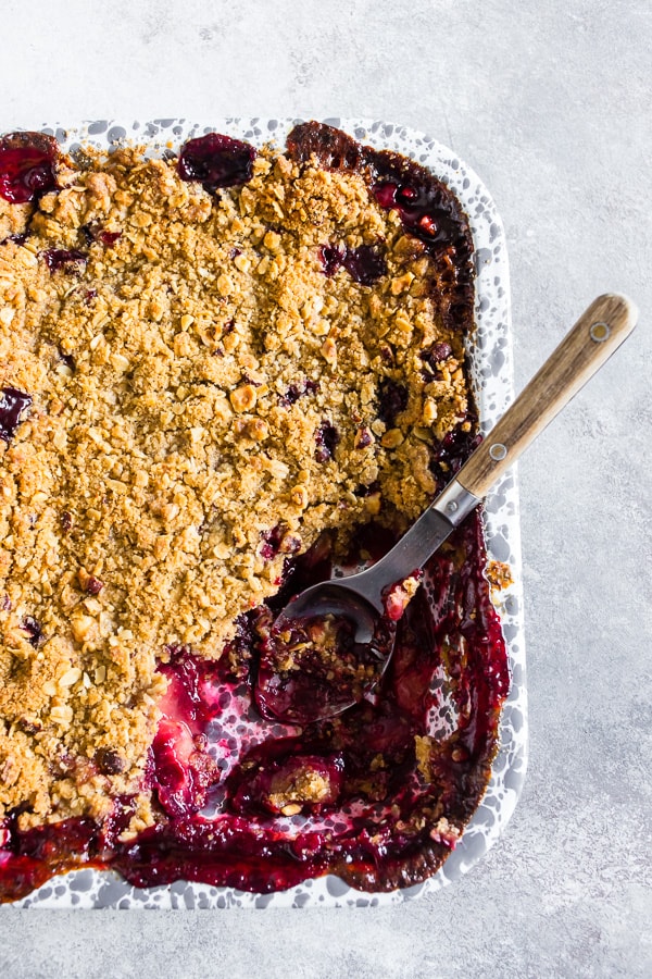 This cardamom vanilla plum crisp is filled with juicy plums and topped with a crunchy oatmeal hazelnut topping. It's the perfect sweet treat to end the day with a perfect hint of vanilla bean and cardamom flavor. 