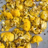 This super simple roasted orange cauliflower is the perfect side dish vegetable. Plus the deep orange color is not only pretty but it provides more Vitamin A than typical cauliflower. It's healthy, delicious and can be used in place of any traditional cauliflower recipe. 