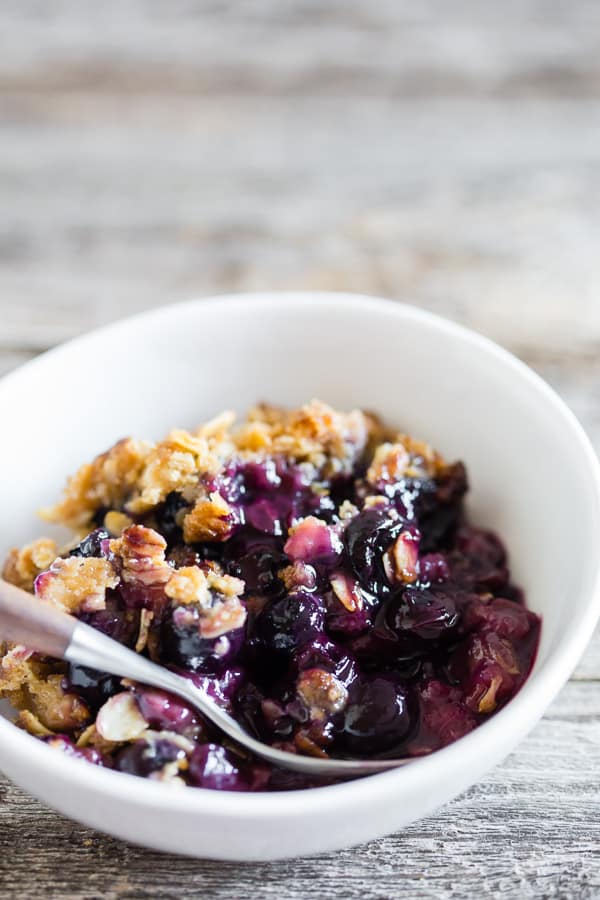 This blueberry rhubarb crisp is the perfect way to celebrate the bounty of summer. Sweet blueberries paired with tart rhubarb and topped with a crunchy rolled oat topping. It's delicious eaten warm and even better when topped with ice cream or whipped cream. 
