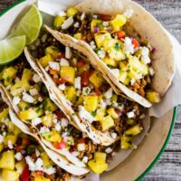 These ground pork tacos with pineapple salsa are the perfect mix of spicy and sweet. They're perfect for a quick weeknight dinner or an easy weekend meal. You'll love all the flavor packed into these tacos!