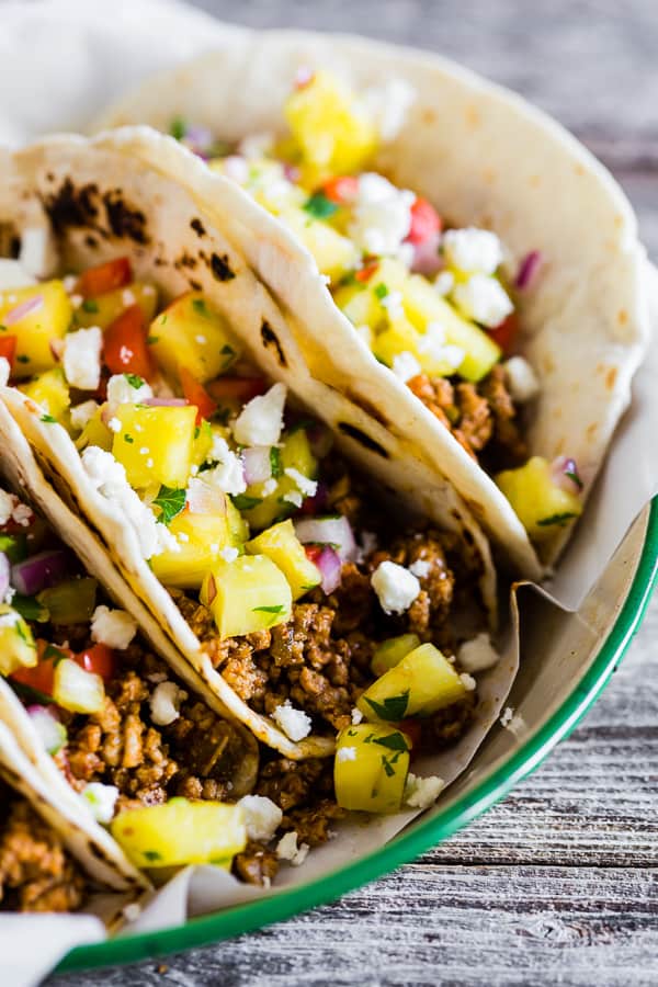 These ground pork tacos with pineapple salsa are the perfect mix of spicy and sweet. They're perfect for a quick weeknight dinner or an easy weekend meal. You'll love all the flavor packed into these tacos!