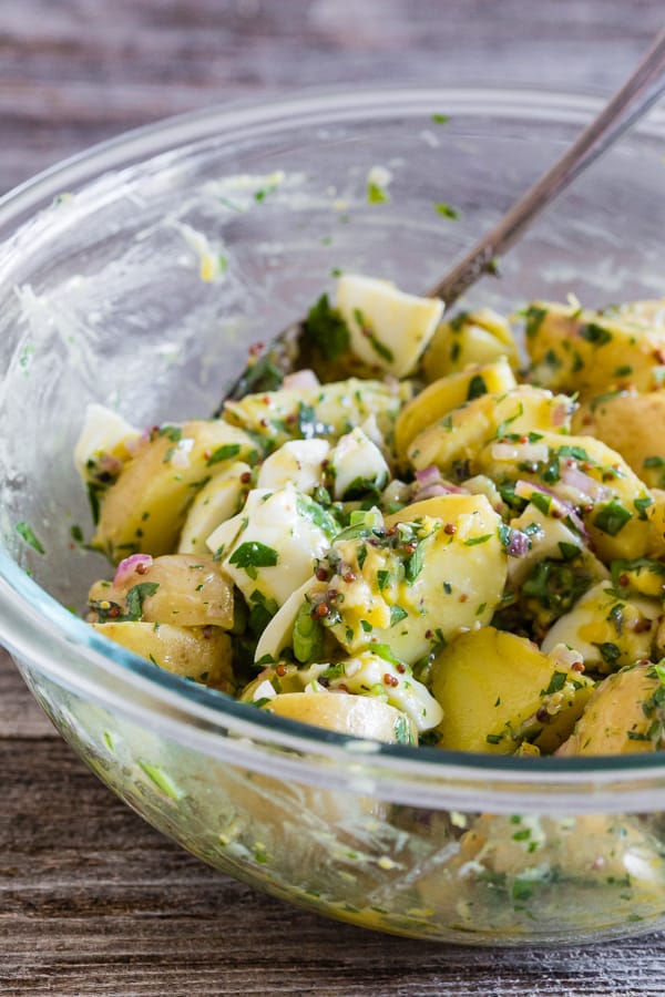This honey mustard potato salad can be served warm or cold but the best part is that it's mayonnaise free, packed full of herbs and just the right amount of whole grain mustard and natural honey. It's a fun twist to traditional potato salad and you'll love the sweet and savory combination. 