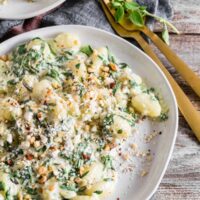 This creamy gorgonzola gnocchi with baby spinach is topped with toasted pine nuts and just a sprinkle of Parmesan cheese. It’s the perfect creamy dish for Meatless Monday or throw on a little grilled steak to take it to a whole new level of protein packed deliciousness. Trust me, you’ll love how easy it is to make this flavorful dish!