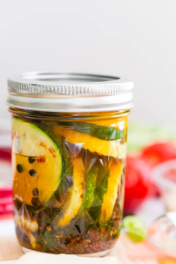 sweet and spicy zucchini pickles in a glass canning jar