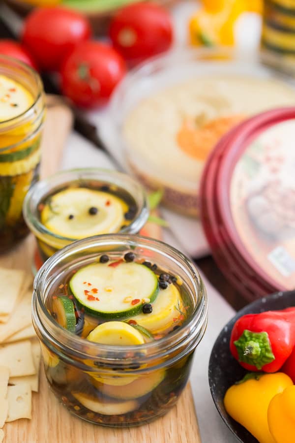sweet and spicy zucchini pickles in small single serving glass jars