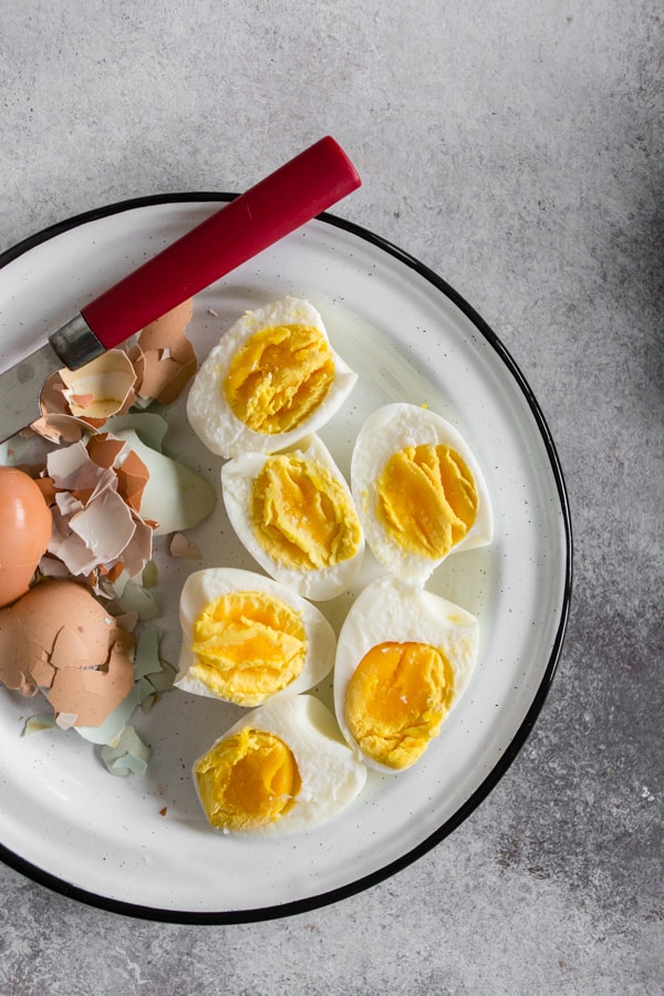 Instant Pot Hard Boiled Eggs peeled on a plate. 