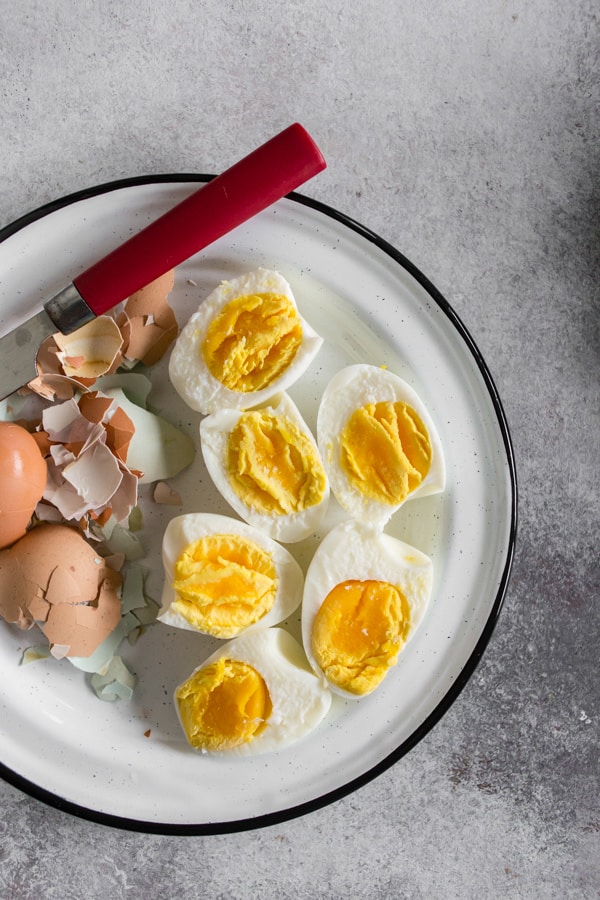 These pressure cooker hard boiled eggs turn out perfect every single time! The best part is that they peel easily without sticking to the white of the egg. Eat them plain, sprinkle with seasoning or throw them in a salad - these eggs can do it all!