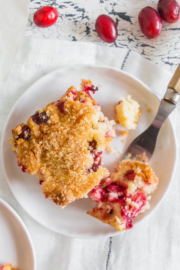 This vanilla cranberry buttermilk cake is the perfect Christmas cake. Full of fresh cranberries, vanilla beans, orange zest and a sprinkle of turbinado sugar on top for an extra special sparkly surprise. You'll love how easy it is to make this tasty breakfast or dessert treat!