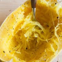 Have you ever wondered how to cook spaghetti squash in the microwave? I'm going to show you just how easy it is to cook spaghetti squash. Plus I'm going to give you a few delicious recipes to use with your perfectly cooked spaghetti squash. 