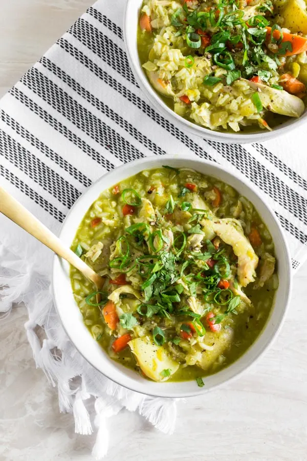 This Peruvian chicken soup (aka: aguadito de pollo) is a delicious winter soup full of rotisserie chicken, rice, vegetables, and LOTS of cilantro. Super simple to make and ready in just an hour. It's the perfect weekday or weekend soup! 