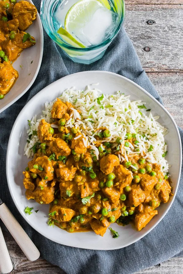 Instant Pot Chicken Tikka Masala on a  plate with rice. 