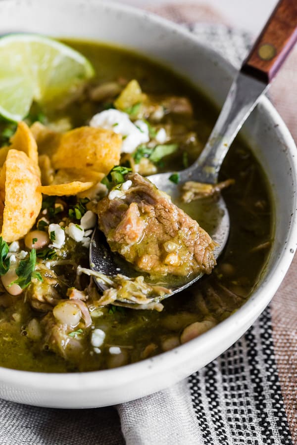 This Instant Pot pork chili verde is packed full of flavor and fork tender pork shoulder. If you love tomatillos and cilantro this soup is for you!