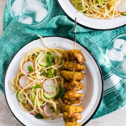 These chicken satay noodles give you all the flavor of takeout but in a homemade dish that will leave you feeling full and satisfied. Peanut butter marinated chicken skewers served with a homemade noodle salad that tastes just like traditional Thai cucumber sauce. You'll love this light and flavorful dish that is perfect for warm spring days!