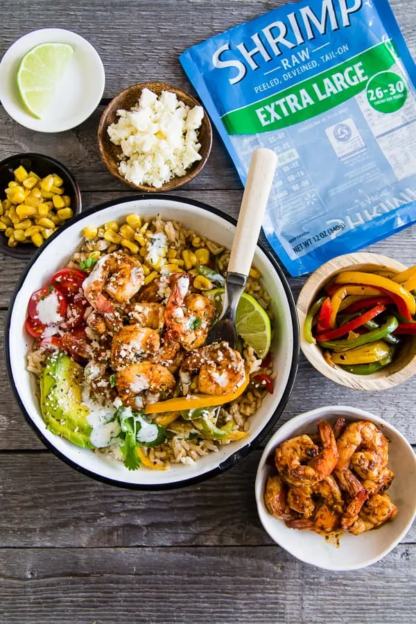 Chipotle Shrimp Fajita Bowls served with extra toppings. 