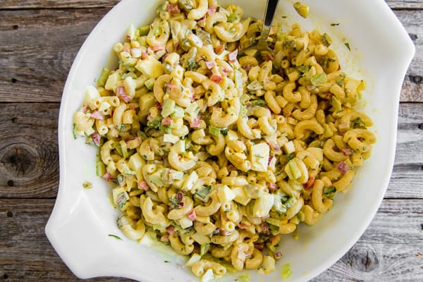 This classic macaroni salad is packed full of crunchy vegetables, hard-boiled eggs, and a homemade dressing made out of yellow mustard, mayonnaise, and pickle juice. It's the perfect old fashioned Easter side dish or a delicious summertime cookout addition.