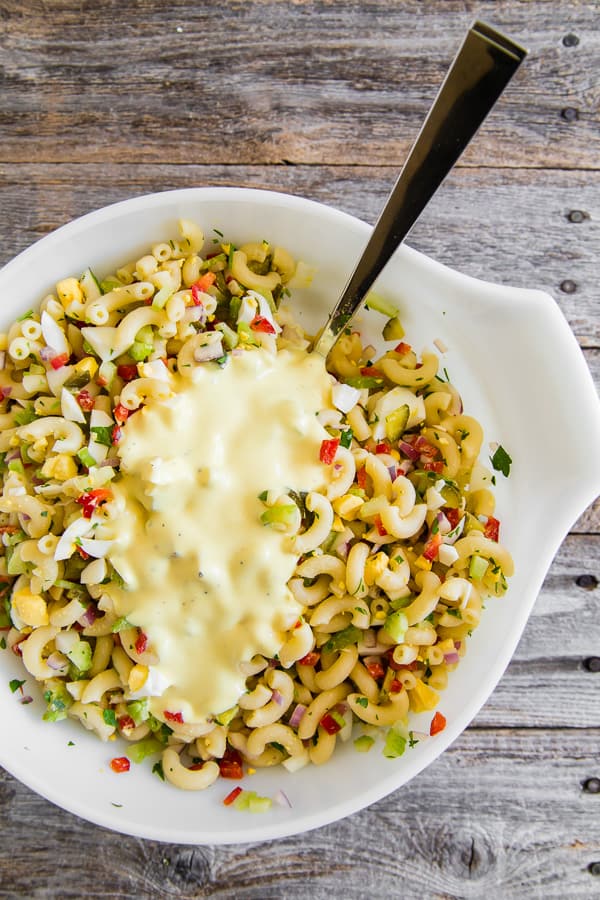 This classic macaroni salad is packed full of crunchy vegetables, hard-boiled eggs, and a homemade dressing made out of yellow mustard, mayonnaise, and pickle juice. It's the perfect old fashioned Easter side dish or a delicious summertime cookout addition.