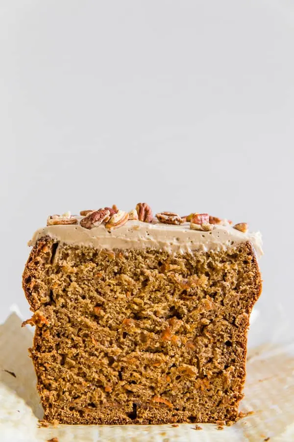 This carrot cake banana bread is topped with a creamy maple cream cheese frosting and the perfect use for ripe bananas. It's a flavorful twist to a classic quick bread that you're sure to love.