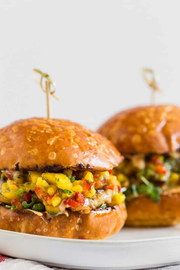 These chipotle chicken burgers are topped with fiery pepper jack cheese and fresh homemade mango salsa. Trust me, this burger is packed full of flavor and the perfect addition to your summer BBQ. 
