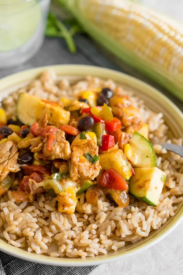 tex mex chicken and vegetable skillet served over brown rice.