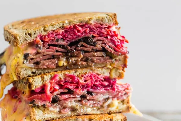 This grilled pastrami root vegetable slaw sandwich is the perfect autumn sandwich. It’s grilled until the outside is crispy and the inside is perfectly warmed through. Plus, the addition of a homemade root vegetable slaw takes this sandwich to a whole new level of deliciousness.