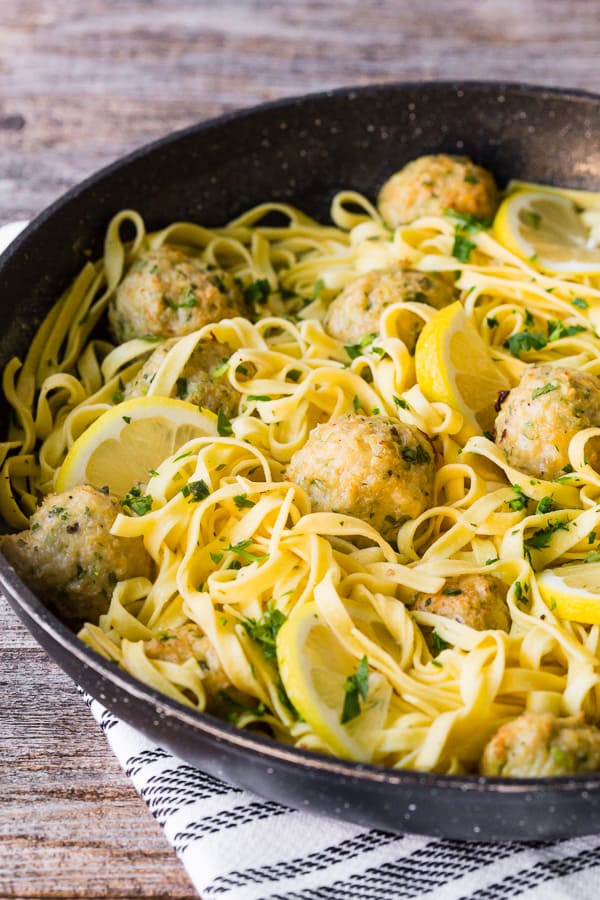 Baked Chicken Francese Meatballs in a pan with pasta