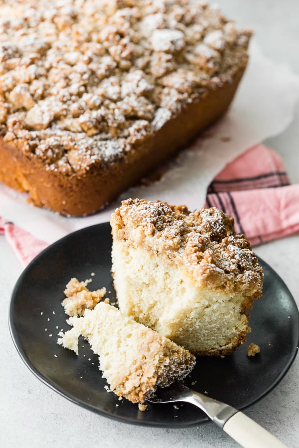 sourdough discard cinnamon crumb cake sliced on a plate with a fork
