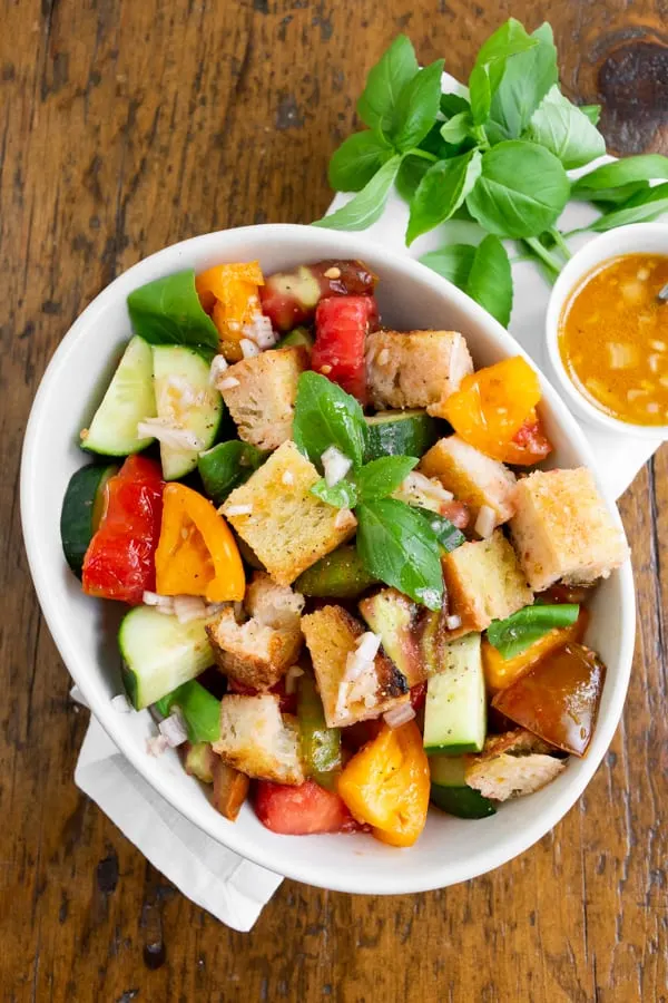 grilled sourdough panzanella salad with tomato water dressing