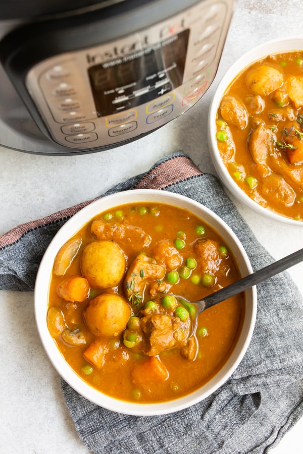 instant pot pumpkin beef stew in bowls with the instant pot