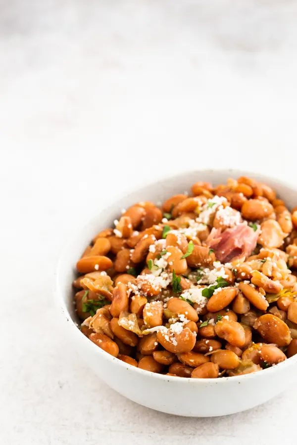 Instant Pot pinto beans in a white ceramic bowl