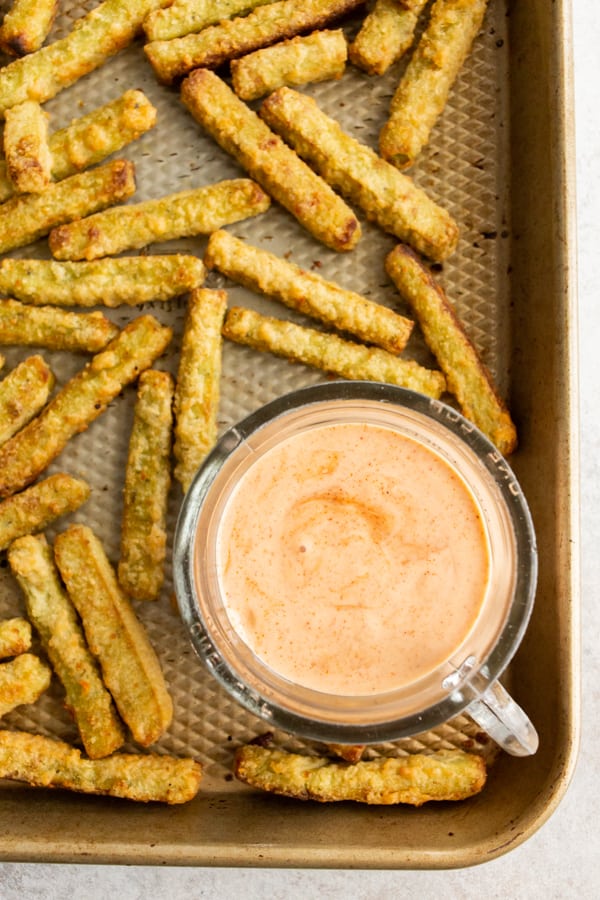 homemade fry sauce in a dipping bowl surrounded by baked veggie fries. 