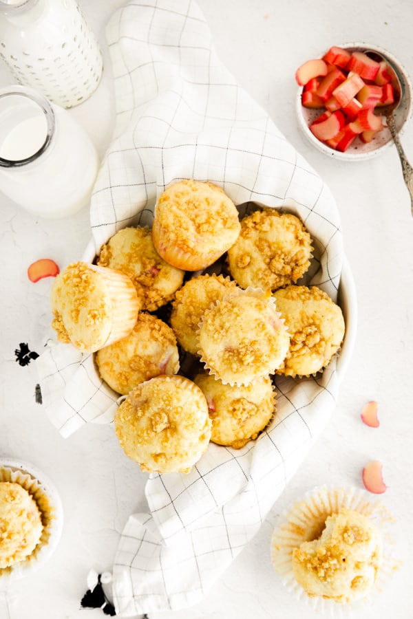 streusel topped rhubarb muffins in a basket.