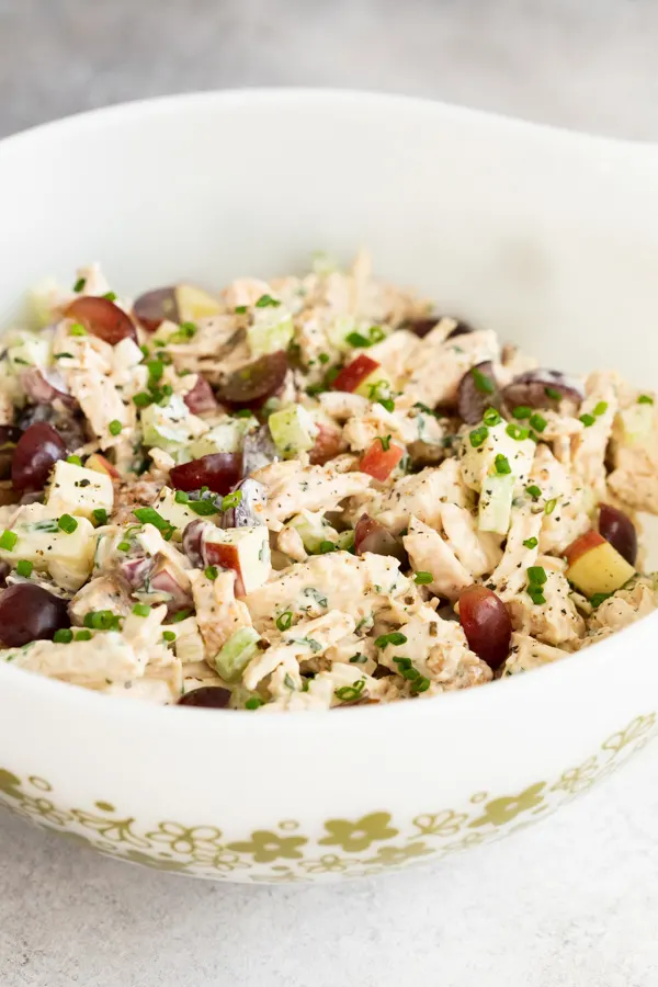 the best chicken salad stirred in a a mixing bowl. 