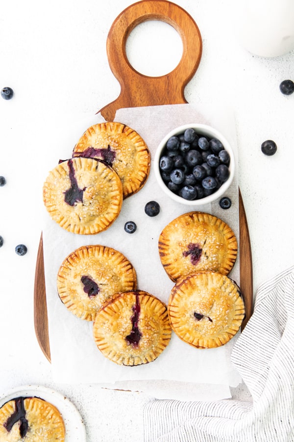 Easy Blueberry Hand Pies served with fresh blueberries. 