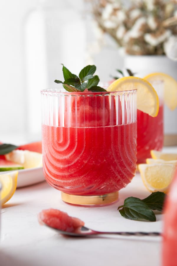Watermelon Frose sitting in a glass cup. 