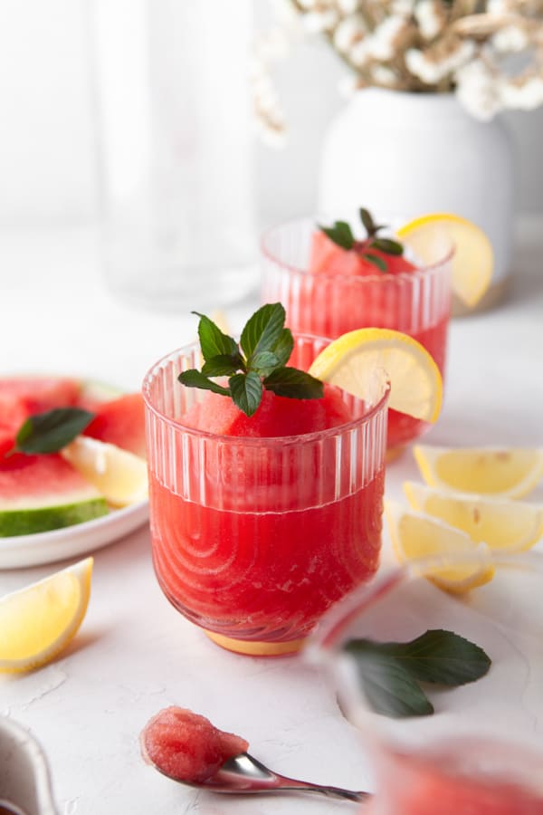 Watermelon Frose in a fancy glass with mint and lemon. 
