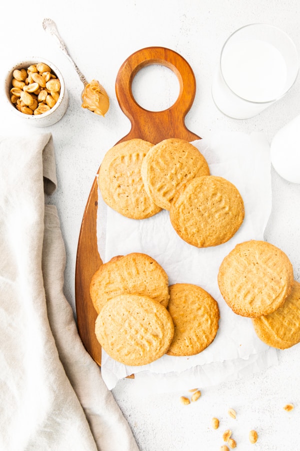 Brown Butter Peanut Butter Cookies served on a wooden cutting board. 