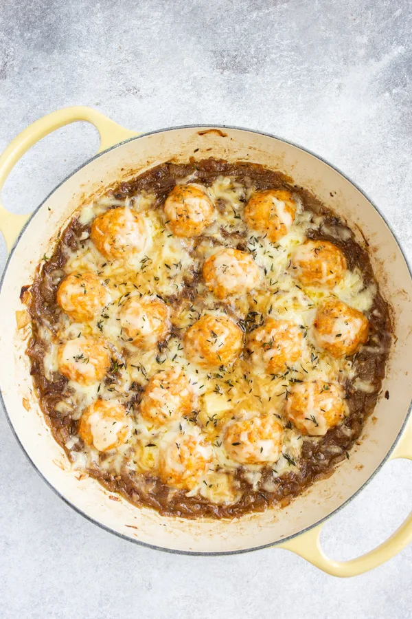French Onion Chicken Meatballs in a pan topped with cheese. 