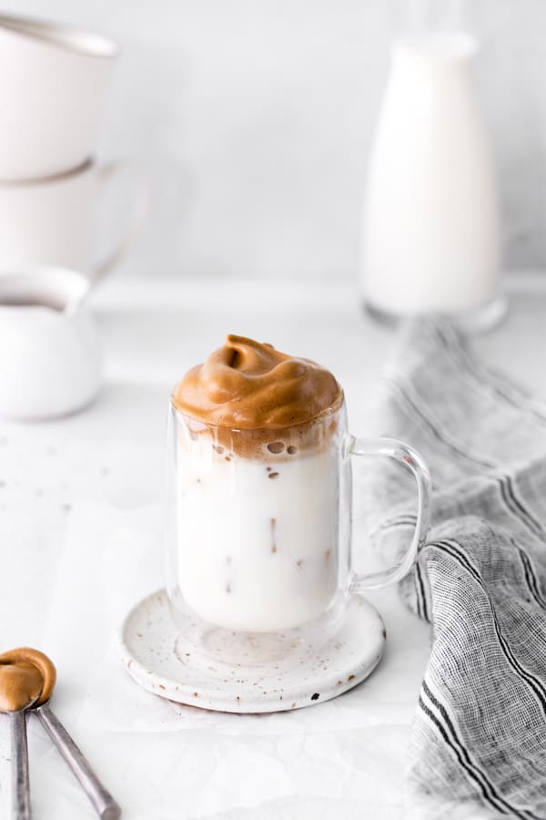 Maple Whipped Coffee in a glass coffee cup. 