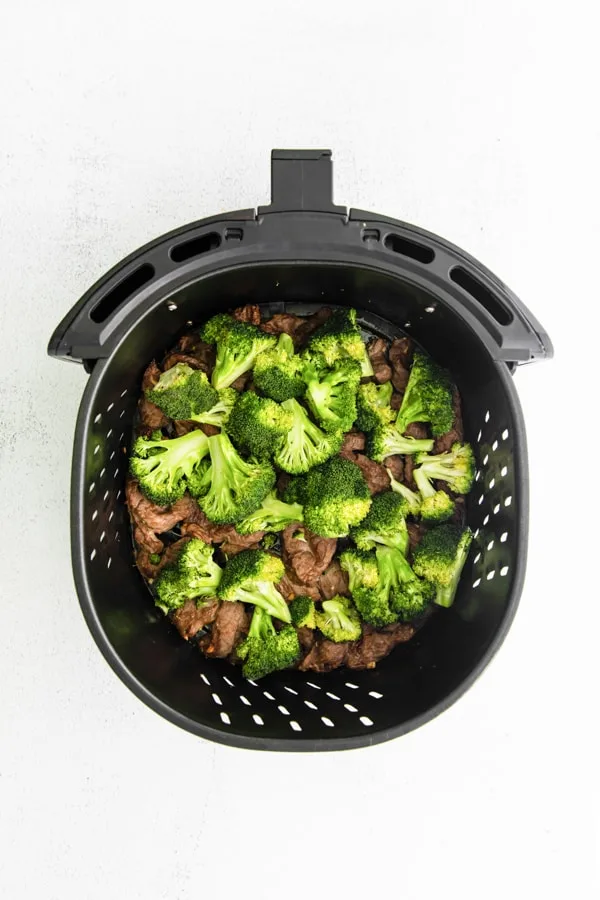 Air Fryer Beef and Broccoli in the air fryer basket. 