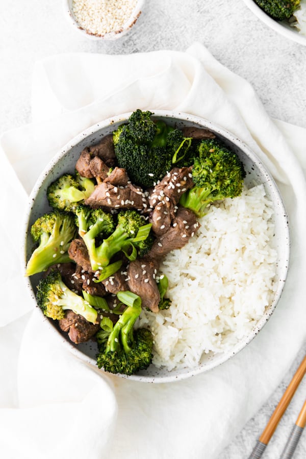 Air Fryer Beef and Broccoli served in a bowl with rice. 