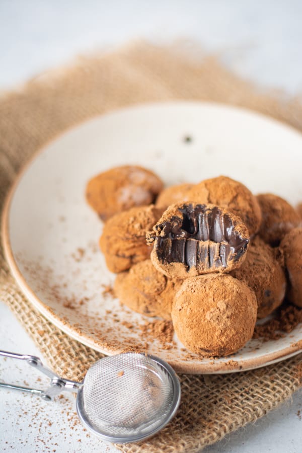 A Classic Chocolate Truffles with a bite taken out of it. 