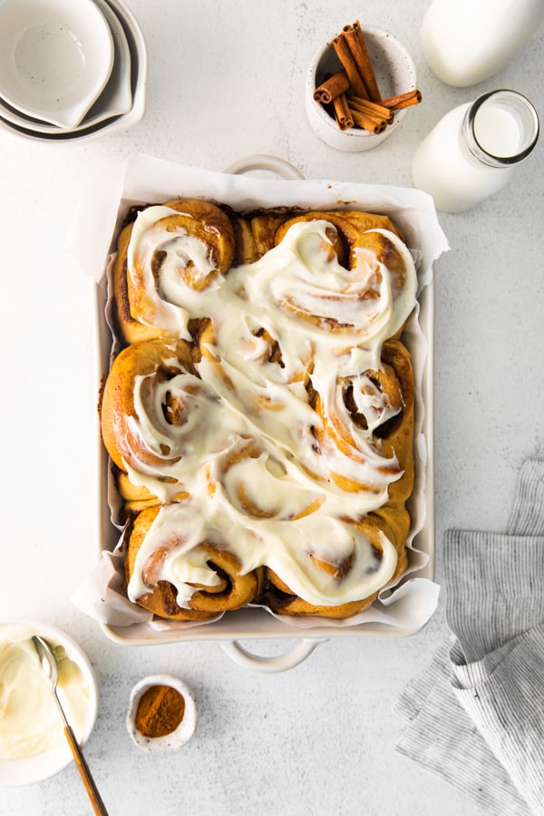 Gingerbread Cinnamon Rolls topped with cream cheese frosting. 