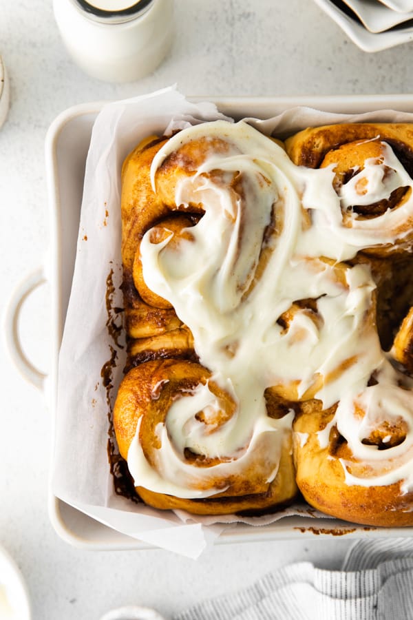 Gingerbread Cinnamon Rolls topped with a creamy cream cheese frosting. 