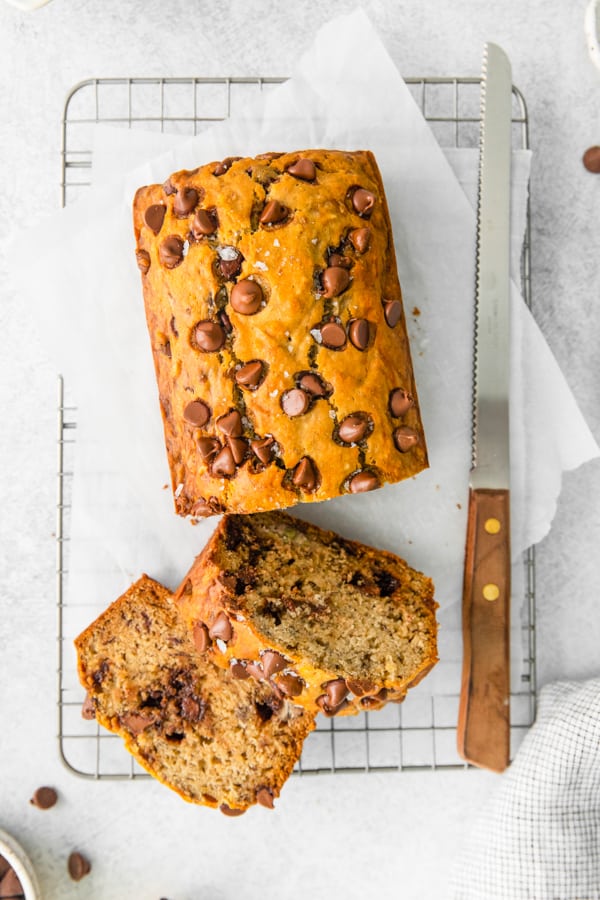 Chocolate Chip Banana Bread sitting on a cooling rack. 
