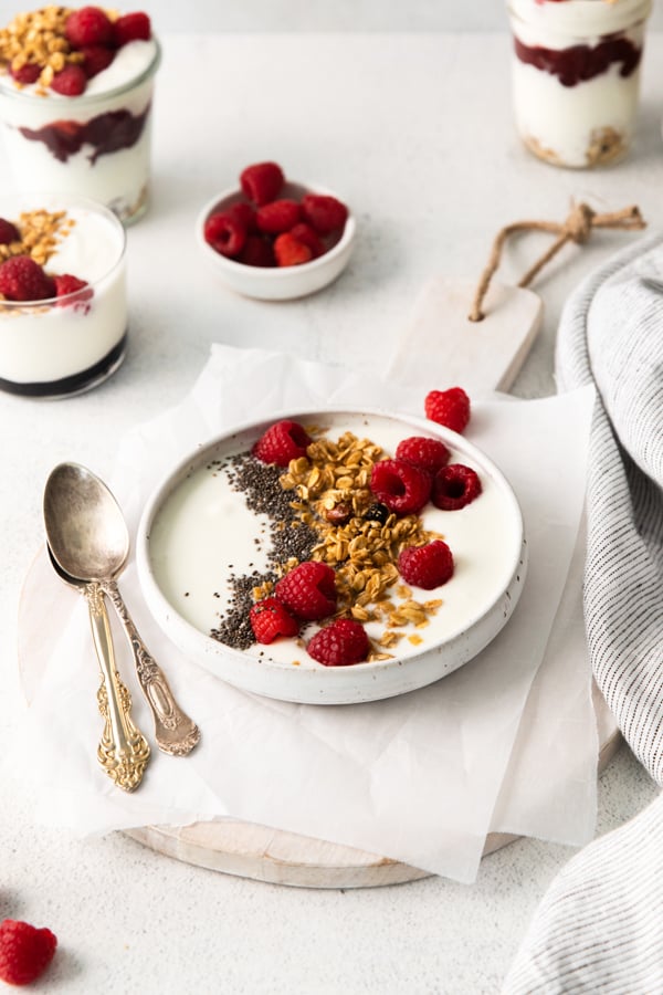 Instant Pot Yogurt topped with granola and fruit. 