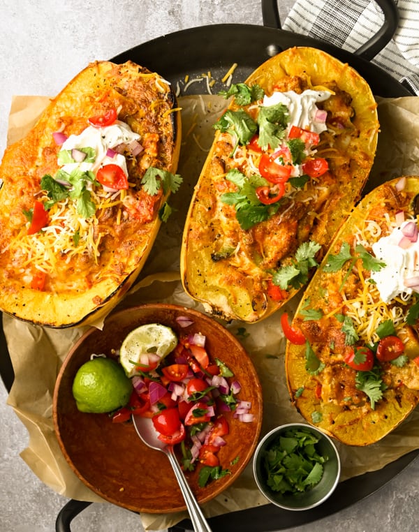 Ground Chicken Fajita Spaghetti Squash served with toppings. 