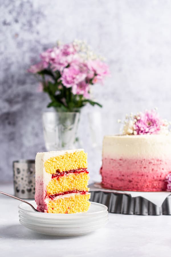 Strawberry Coconut Layer Cake served on a plate. 