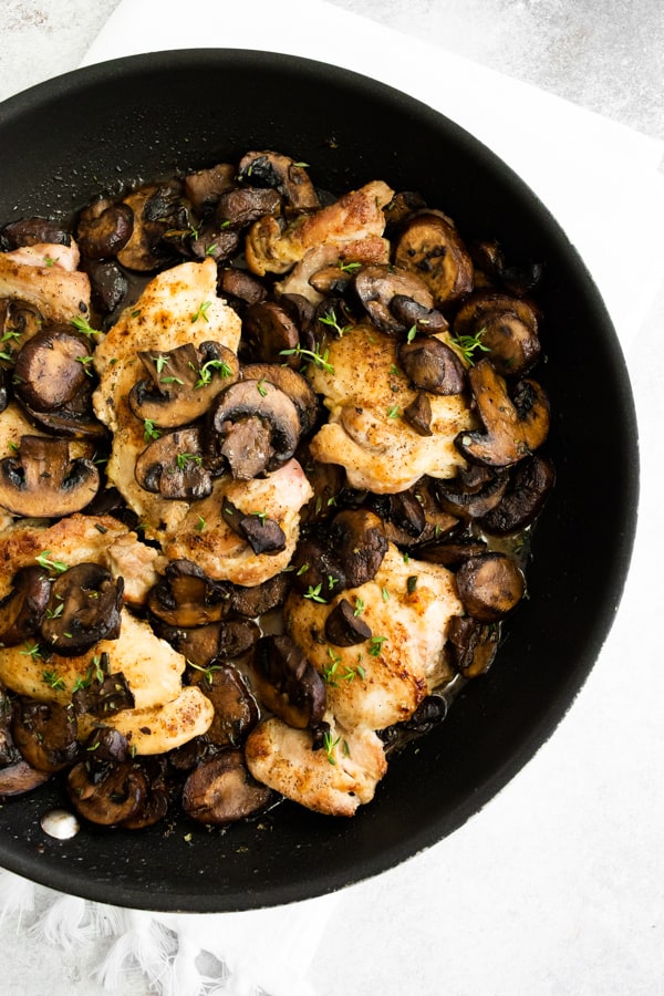 Garlic Mushroom Chicken Thighs in a pan. 