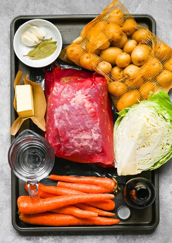 Ingredients to make Instant Pot Corned Beef on a sheet pan. 