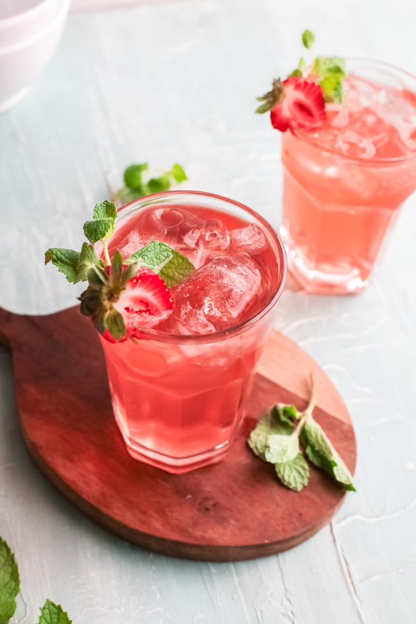 Strawberry Basil Gin Rickey served with sliced strawberries. 